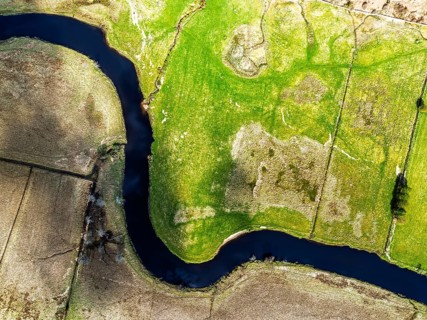 Top Down over Farms and River Dochart and Road A85 from a drone, Perthshire, Scotland, UK