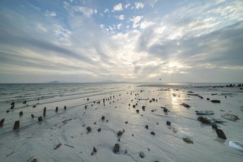 Structures in the sand at sunrise on Sivalai Beach, Koh Mook Island, Satun Province, Southern