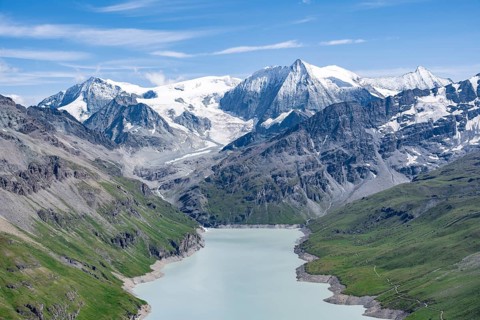 Blue mountain lake in a mountain landscape with glaciers, Lac des Dix reservoir and Mont Blanc de