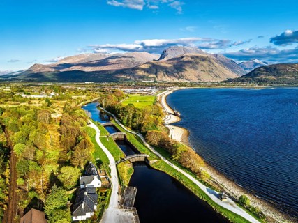 View of Caledonian Canal, Caol Beach and Nevis Range Mountains from a drone, Corpach, Fort William,
