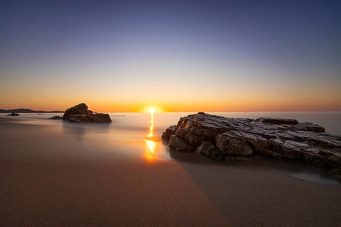 The sun rises on the Costa Rei, a stretch of coastline on the Italian Mediterranean island of