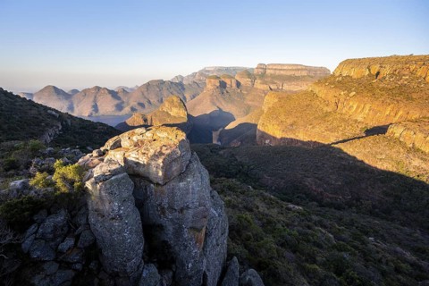 Sunset at Blyde River Canyon with Three Rondawels peak, view of canyon with Blyde River and table
