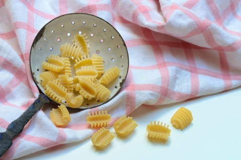 Italian pasta in a sieve, Radiatori variety