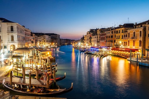 View of the Grand Canal at the blue hour, picturesque evening mood with illuminated palazzos on the