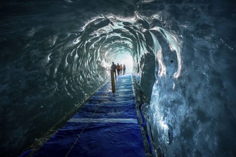 Artificial ice cave through the glacier ice, Mer de Glace, Montenvers, Chamonix, Haute-Savoie,