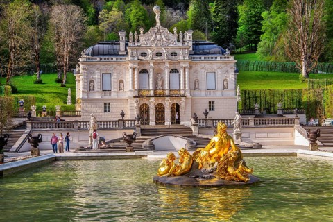 Water parterre with flora fountain and the portal of Linderhof Castle in spring, municipality of