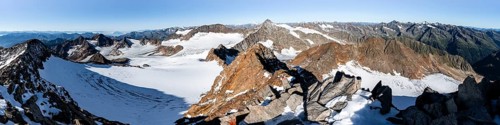 Mountain panorama at Wilder Freiger summit, picturesque high mountain landscape with snow, view of
