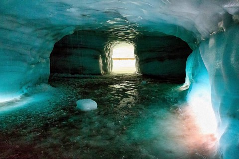 Ice tunnel, illuminated glacier cave, melting ice, illustration, Langjökull glacier, Husafell,
