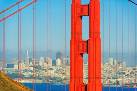 View of Golden Gate Bridge and financial district in the distance, San Francisco, California, USA