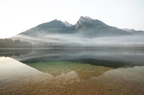 Magical sunrise with fog at Hintersee near Ramsau in Berchtesgadener Land