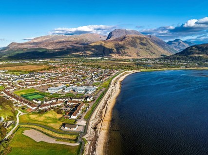 View of Caol Beach and Nevis Range Mountains from a drone, Corpach, Fort William, Highland,