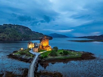 Night over Eilean Donan Castle and Loch Duich from a drone, Isle of Skye, Highlands, Scotland,