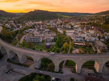 Panoramic view of a town with viaduct and buildings in the evening, Nagold, district of Calw,