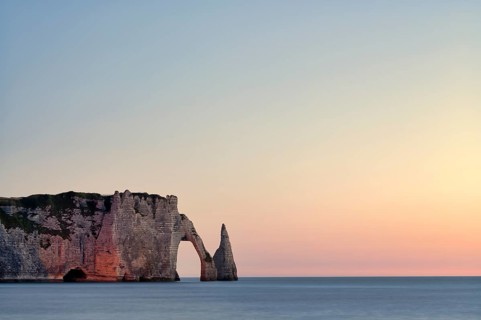 Rock arch Falaise or Porte d'Aval and rock needle Aiguille, illuminated, illuminated, Étretat, sea,