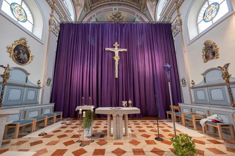Large purple Lenten cloth in front of the high altar in the baroque parish church of St Nicholas,