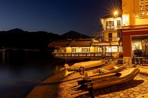 Cafe with fishing boats, Orta San Giulio, on Lake Orta, Province of Novara, Piedmont, Lago d'Orta,