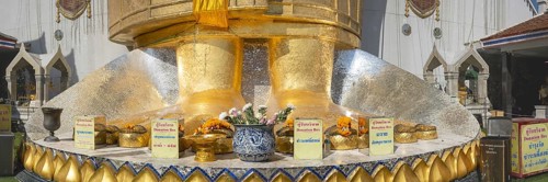 Feet of a 32 metre high standing Buddha decorated with glass mosaics and 24-carat gold, Luang Pho