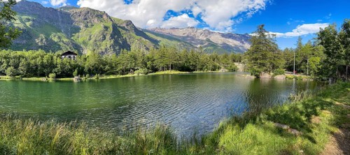 View of small picturesque romantic mountain lake Lago Grande near Moncenisio in Val Cenischia in