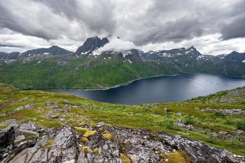 View of Mefjorden fjord from Barden mountain, Breidtind mountain peak behind, Senja, Norway