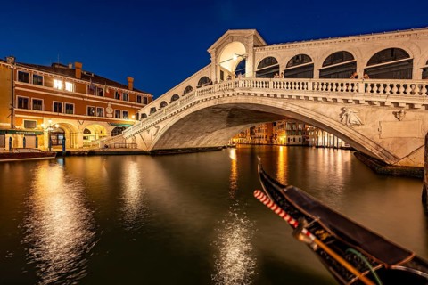 Rialto Bridge and gondolas on the Grand Canal, blue hour, long exposure, Venice, Veneto, Italy