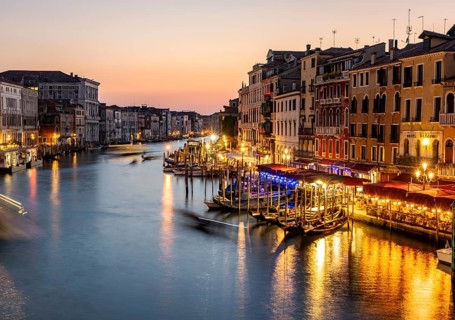 View of the Grand Canal at the blue hour, picturesque evening mood with illuminated palazzos on the