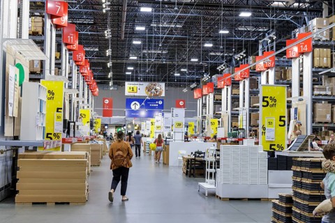 Customers shopping in the warehouse section of IKEA home store