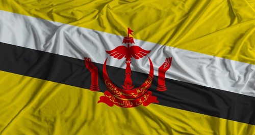Bruneian flag with fabric texture background. National flag of Brunei with cloth texture