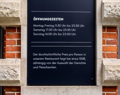 Sign at the entrance to a restaurant on Hausvogteiplatz, Berlin, Germany