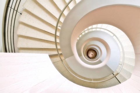 Modern white spiral staircase in an educational building, Zurich, Switzerland