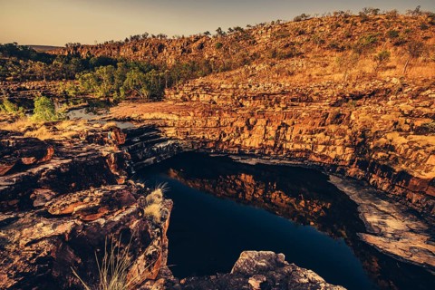 Bell Gorge waterfall, a body of water in north-west Australia in the Kimberley. Sunrise in the