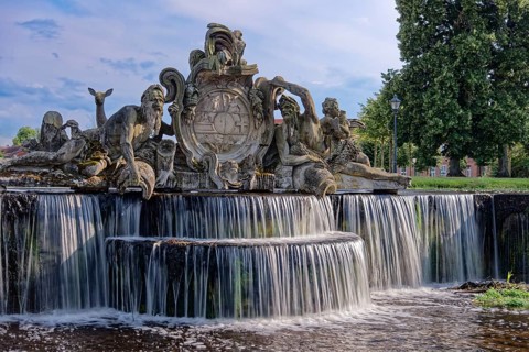 Bassin, a water basin, in front of Ludwigslust Palace, with cascades and stone figures.