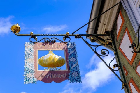 Nose sign, pub sign, onion, Kirchenstraße, half-timbered houses in the old town, Ladenburg,