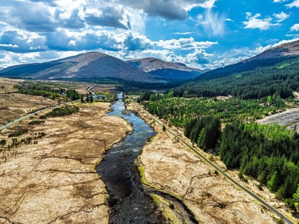 Mountains and Moors over Loch Tulla and River Orchy from a drone, Highlands, Scotland, UK