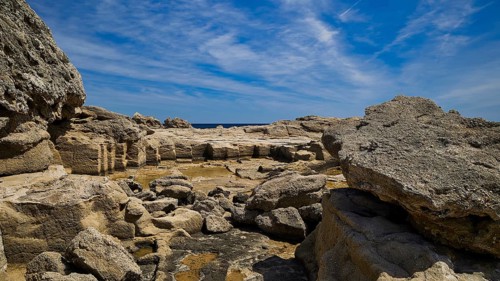 Expansive rocky landscape under a blue sky, Oasis Beach, east coast of Rhodes, Rhodes, Dodecanese,