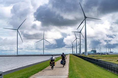 Strekdammen Wind Farm, wind farm at the seaport of Eemshaven in the Netherlands, left, built on
