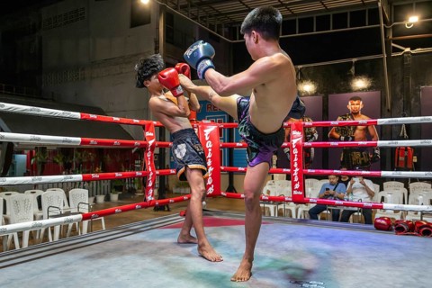 Thai boxing Muai Thai boxer in action, Pattaya, Thailand