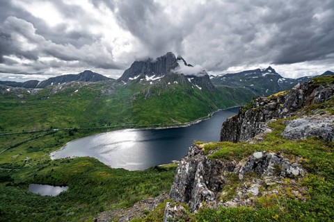 View of Mefjorden fjord from Barden mountain, Breidtind mountain peak behind, Senja, Norway