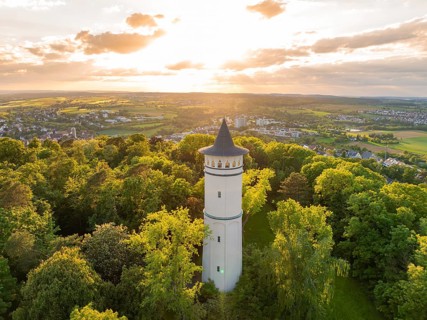 In the sunset light, a tower rises above the blossoming scenery, Engelberg Tower, Leonberg, Germany