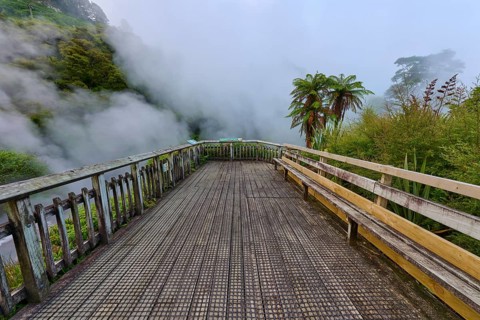 Viewing platform in a steamy, misty environment surrounded by nature, Te Manaroa Spring, Hot