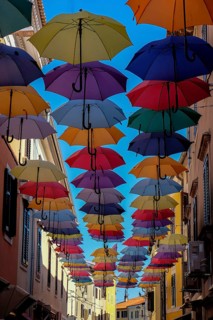 Colourful umbrellas over a street, Novigrad, Istria, Croatia