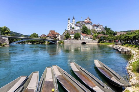 Aarburg town on the River Aare with church, fortress and boats in Aarburg, Switzerland