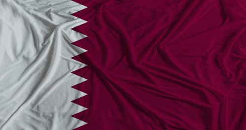 Qatari flag with fabric texture background. National flag of Qatar with cloth texture