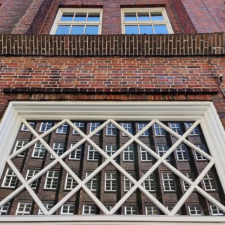 Reflection of the façade of the Sprinkenhof, Brick Expressionism, Kontorhausviertel, UNESCO World