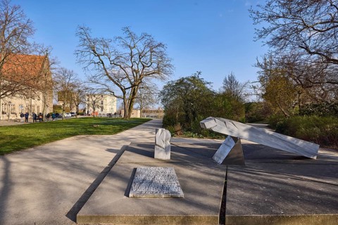 Memorial to the Persecution of the Sinti and Roma, park, lawn, bare winter trees, path, blue sky,