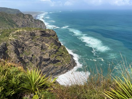 Breathtaking cliffs overlooking the turquoise blue sea and wild vegetation at Mercer Bay Loop Walk