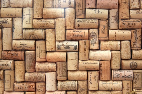 Corks from wine bottles laid as a regular pattern, wine corks, red wine