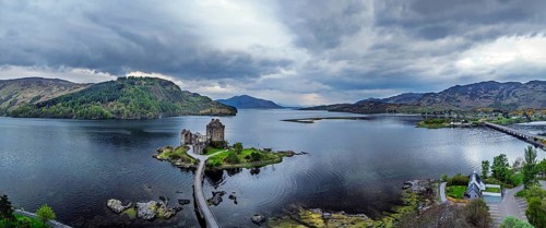 Panorama of Eilean Donan Castle and Loch Duich from a drone, Isle of Skye, Highlands, Scotland,