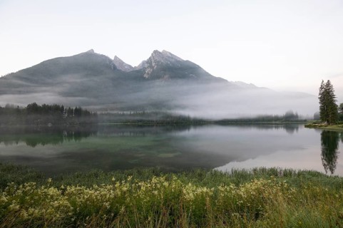 Magical sunrise with fog at Hintersee near Ramsau in Berchtesgadener Land