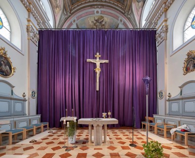 Large purple Lenten cloth in front of the high altar in the baroque parish church of St Nicholas,
