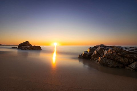 The sun rises on the Costa Rei, a stretch of coastline on the Italian Mediterranean island of
